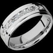 7 mm wide/Flat Grooved Edges/Cobalt Chrome band with an  arrangement of 9, .1 carat Round Diamond stones in a Channel setting.
