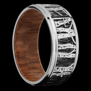 9 mm wide/Flat Grooved Edges/Cobalt Chrome band with a laser carved Aspen pattern also featuring a Leopard Wood sleeve.