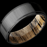 8 mm wide Flat Grooved Edges Zirconium band featuring a Spalted Tamarind sleeve.