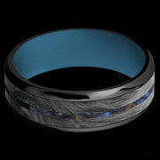 7 mm wide/Beveled/Zirconium band featuring inlays of Forged Carbon Fiber and Blue Tiger Eye also featuring a Royal Blue sleeve.