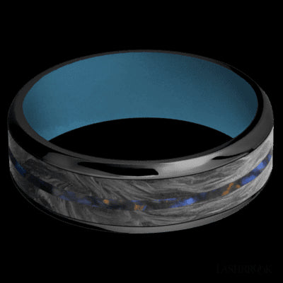 7 mm wide/Beveled/Zirconium band featuring inlays of Forged Carbon Fiber and Blue Tiger Eye also featuring a Royal Blue sleeve.